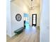 Bright entryway with a modern front door, bench seating, and stylish light fixture at 261 Arborview Dr, Mcdonough, GA 30252