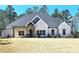Charming single-story home with beautiful brick facade, inviting front porch, and well-maintained lawn at 261 Arborview Dr, Mcdonough, GA 30252