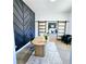 Contemporary home office with custom shelving, sliding doors, and a modern desk at 261 Arborview Dr, Mcdonough, GA 30252