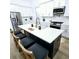Spacious kitchen featuring a large island, white cabinets, and modern stainless appliances at 261 Arborview Dr, Mcdonough, GA 30252
