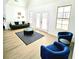 Bright living room features double doors and natural light at 261 Arborview Dr, Mcdonough, GA 30252