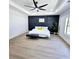 Spacious main bedroom features a tray ceiling, a ceiling fan and paneling at 261 Arborview Dr, Mcdonough, GA 30252