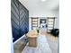 Modern office space featuring sliding barn doors and a unique accent wall at 261 Arborview Dr, Mcdonough, GA 30252