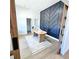 Stylish home office space with sliding barn doors and a decorative accent wall at 261 Arborview Dr, Mcdonough, GA 30252