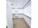 Walk-in closet with hardwood floors and shelving at 261 Arborview Dr, Mcdonough, GA 30252