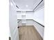 Walk-in closet features built-in shelving and closet rods at 261 Arborview Dr, Mcdonough, GA 30252