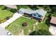 Aerial view of a two-story home with a well-maintained lawn and lush landscaping at 3996 Indian Manor Dr, Stone Mountain, GA 30083