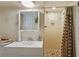 Bathroom with a mirror, white sink, and shower at 3996 Indian Manor Dr, Stone Mountain, GA 30083