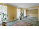 Sunlit living room with plants, neutral rug, decorative trim, and attached room with wallpaper at 3996 Indian Manor Dr, Stone Mountain, GA 30083