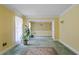 Charming living room with yellow walls and green carpet at 3996 Indian Manor Dr, Stone Mountain, GA 30083