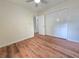 Bedroom featuring new flooring, closet and modern ceiling fan at 5229 Mountain Village Ct, Stone Mountain, GA 30083
