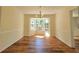 Spacious dining room featuring a bay window and contemporary lighting at 5229 Mountain Village Ct, Stone Mountain, GA 30083
