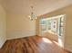 Dining room featuring a bay window and chandelier light fixture at 5229 Mountain Village Ct, Stone Mountain, GA 30083