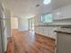 Bright kitchen features white cabinets, stainless appliances, and a beautiful granite countertop at 5229 Mountain Village Ct, Stone Mountain, GA 30083