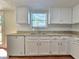 Bright kitchen featuring white appliances and granite countertops at 5229 Mountain Village Ct, Stone Mountain, GA 30083