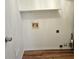 Laundry room with overhead shelving and hookups, ready for appliances at 5229 Mountain Village Ct, Stone Mountain, GA 30083