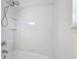 A walk-in shower features dual shower heads, built-in shelving, and a sleek design at 5229 Mountain Village Ct, Stone Mountain, GA 30083