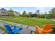 Charming community green with seating, stage, lush lawn, and sidewalks among beautiful homes; a lovely gathering spot at 9244 Main Street # 102, Woodstock, GA 30188