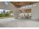 Community building with open layout, modern lighting, and ample space for gatherings, with outside view of homes at 9244 Main Street # 102, Woodstock, GA 30188