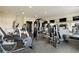 Well-equipped fitness center with modern machines and mirrored walls at 9244 Main Street # 102, Woodstock, GA 30188