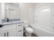Bathroom with white vanity, granite countertops, and tub-shower combo at 110 Doris Path, Dallas, GA 30157