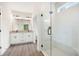 Bright bathroom featuring a glass-enclosed shower and a double vanity with modern finishes at 110 Doris Path, Dallas, GA 30157