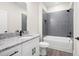 Bathroom features modern gray subway tile, white vanity and dark fixtures at 110 Doris Path, Dallas, GA 30157