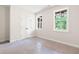 An unfinished bedroom with a large window and closet at 110 Doris Path, Dallas, GA 30157