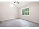 Bedroom with vaulted ceilings, natural light, and new flooring covered with plastic at 110 Doris Path, Dallas, GA 30157