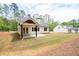 Beautiful white home with a covered patio and spacious backyard at 110 Doris Path, Dallas, GA 30157