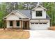 Charming new construction with white siding, stone accents, and a welcoming covered porch at 110 Doris Path, Dallas, GA 30157