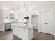 Modern kitchen with white cabinets, granite countertops, and stainless steel appliances at 110 Doris Path, Dallas, GA 30157
