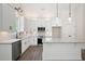 Modern kitchen featuring granite countertops, white cabinets, and stainless steel appliances at 110 Doris Path, Dallas, GA 30157