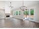 Spacious living room with stone fireplace, recessed lights, and view of outdoor patio at 110 Doris Path, Dallas, GA 30157