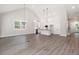 Open concept living space with a kitchen, living room, and dining area with lots of natural light at 110 Doris Path, Dallas, GA 30157