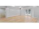 Bright, open basement area with light wood floors and glass paneled doors at 2023 Stoneleigh Dr, Stone Mountain, GA 30087