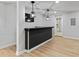 Finished basement with bar area, modern pendant lights, and a door leading to bath area at 2023 Stoneleigh Dr, Stone Mountain, GA 30087