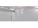 The finished basement features recessed lighting, gold sconces and neutral colored walls at 2023 Stoneleigh Dr, Stone Mountain, GA 30087