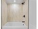 Modern bathroom features a white bathtub and black fixtures at 2023 Stoneleigh Dr, Stone Mountain, GA 30087
