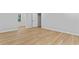 Bright bedroom with new wood-look flooring and a window providing natural light at 2023 Stoneleigh Dr, Stone Mountain, GA 30087