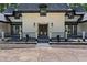 Elegant entryway with ornate double doors, black railings, and manicured landscaping for added curb appeal at 2023 Stoneleigh Dr, Stone Mountain, GA 30087
