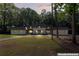 Stately home with a symmetrical design, dark roof, and inviting front porch at 2023 Stoneleigh Dr, Stone Mountain, GA 30087