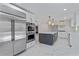 Gourmet kitchen boasting stainless steel appliances, a large island, and elegant marble flooring, perfect for entertaining at 2023 Stoneleigh Dr, Stone Mountain, GA 30087