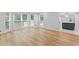 Bright and spacious living room featuring gleaming hardwood floors and a large window for plenty of natural light at 2023 Stoneleigh Dr, Stone Mountain, GA 30087