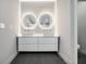 Modern bath with dual vanity, stylish mirrors, and tile flooring at 3139 Alston Dr, Decatur, GA 30032
