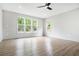 Bright bedroom features wood-look floors, a ceiling fan, and several windows offering ample natural light at 3139 Alston Dr, Decatur, GA 30032