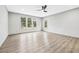 Bright bedroom featuring large windows and light wood-look flooring with a ceiling fan at 3139 Alston Dr, Decatur, GA 30032