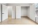 Spacious room with multiple doorways, light walls, and wood grain flooring at 3139 Alston Dr, Decatur, GA 30032