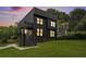 Beautiful modern home with dark siding and a well-maintained front lawn at 3139 Alston Dr, Decatur, GA 30032