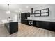 Contemporary kitchen with a large island, black cabinets, and modern appliances at 3139 Alston Dr, Decatur, GA 30032